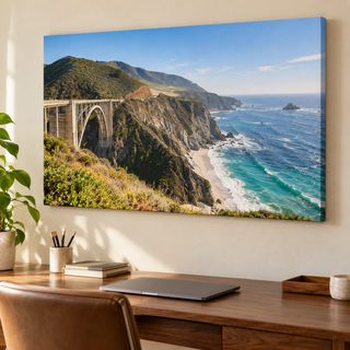 Custom travel photo canvas print of the California coast displayed above a walnut desk